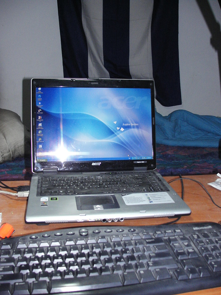 An analyst reading a live revenue dashboard on a laptop at a desk