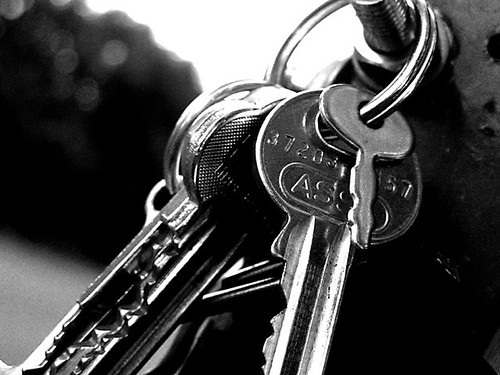 Rows of numbered safe-deposit boxes with keys — your box, your key