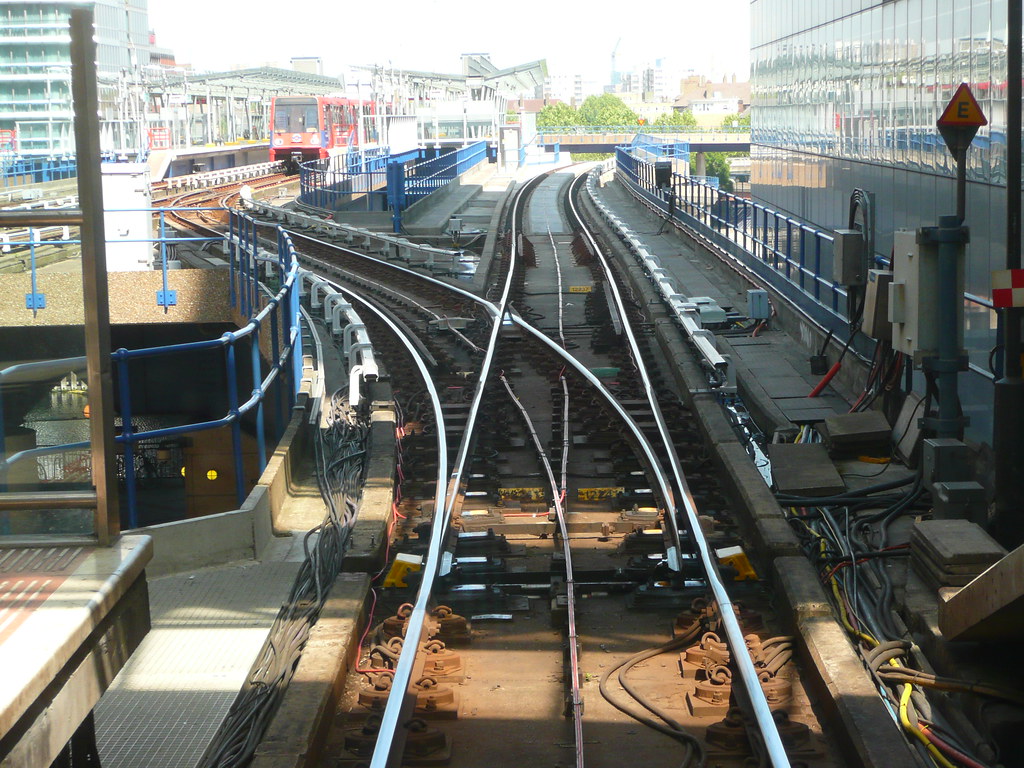 A railway switch re-routing tracks cleanly from one line to another.